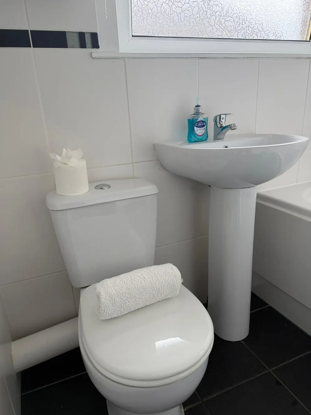 Deep-cleaned bathroom with white pedestal sink in Fife
