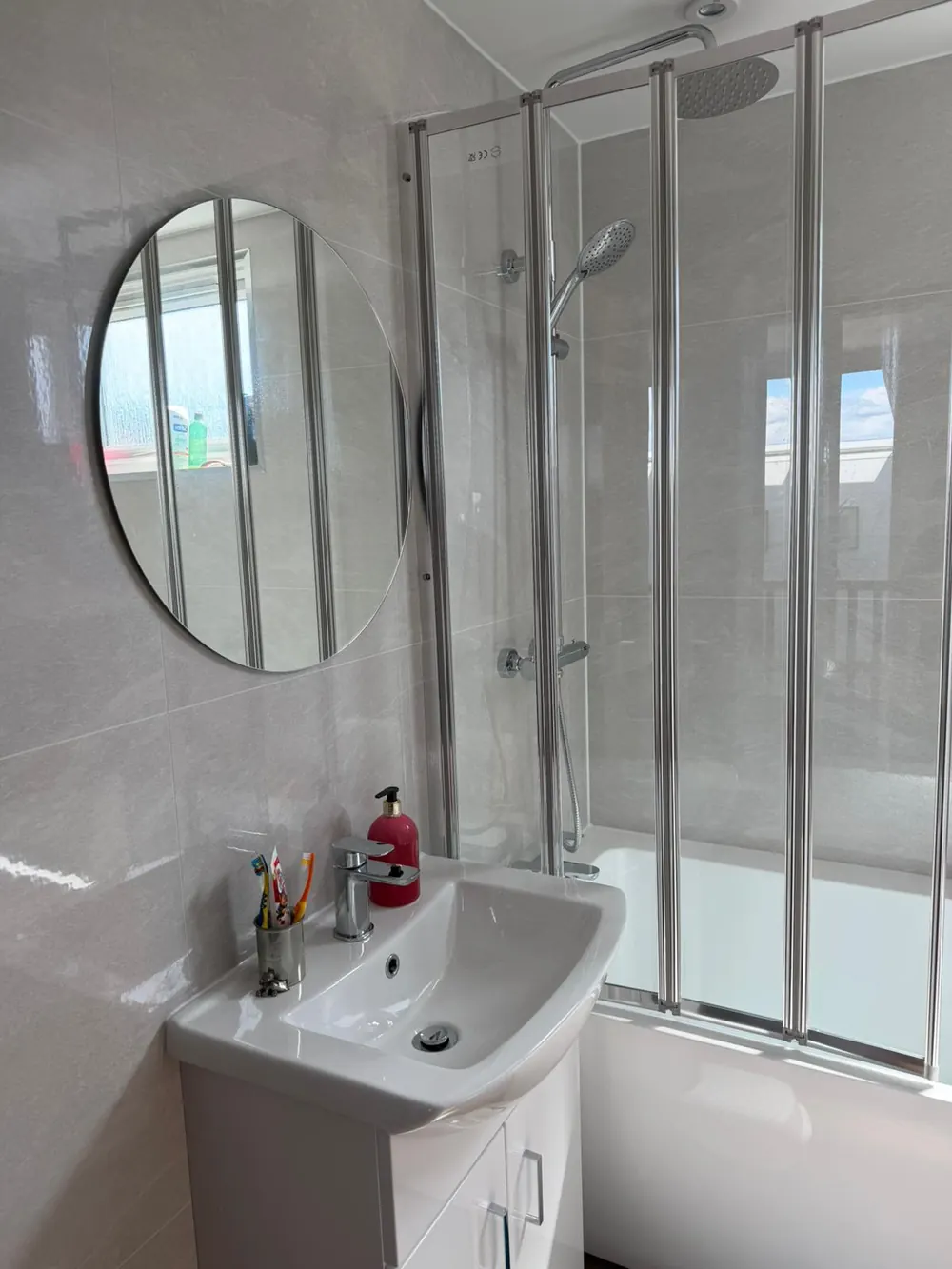 Bright bathroom with shower screen after professional clean in Fife
