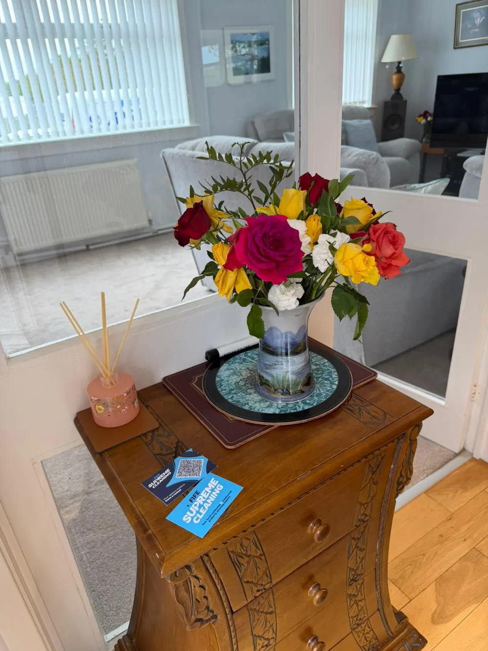 Fife Supreme Cleaning business card on a side table after a domestic clean