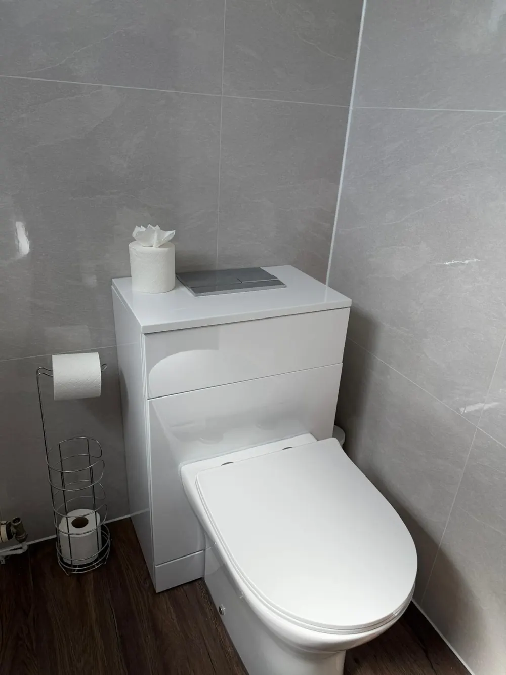 Modern grey-tiled toilet area after professional clean in Fife